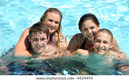 Four teenagers ejoying life in the pool