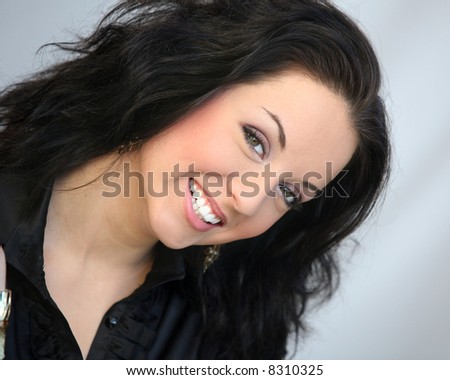 Beautiful young woman with green eyes smiling