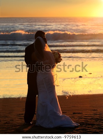 stock photo Couple wedding on the beach at sunset