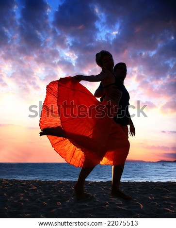 A couple enjoying sunset on the beach