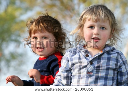 Two happy brothers having fun outdoors