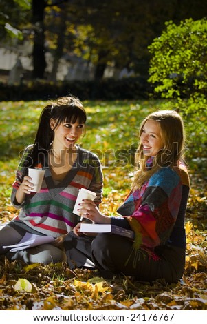 صور لتصميم ستايل كافيه بنات عاجل Stock-photo-two-girls-taking-a-break-from-studying-in-the-park-drinking-coffee-out-of-paper-take-away-cups-24176767