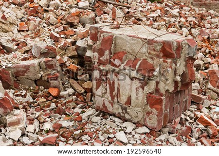 Close-up of a pile of old broken red bricks