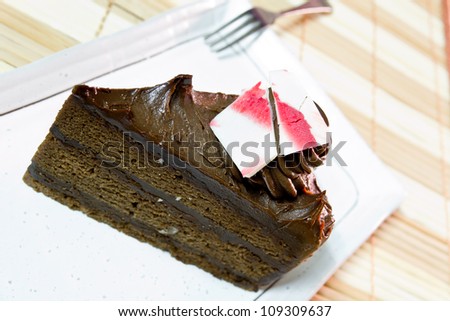 Chocolate truffle cake on white dish