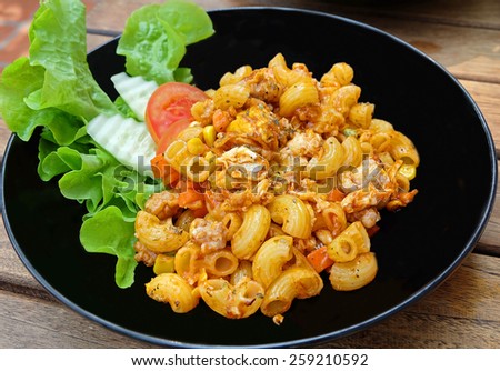 Fried macaroni with egg,chicken and vegetable in tomato sauce