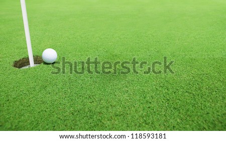 Golf ball near the hole