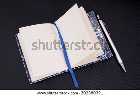 notebook and pen on the desk