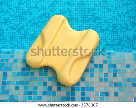 board from polyfoam for swimming lie on the coast in swimming pool