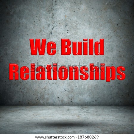 We Build Relationships concrete wall