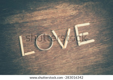 spelling  Love with ring and wood with filter effect retro vintage style