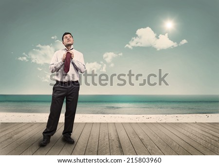 A man adjusts his tie while you enjoy a beautiful sunny day in a seaside