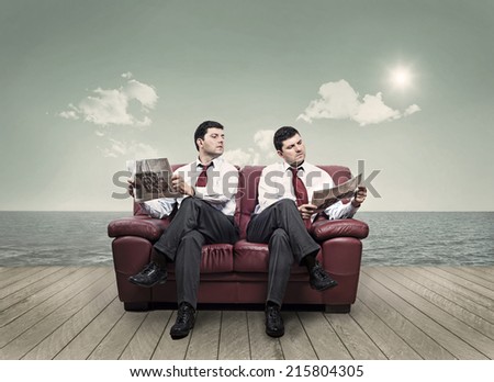 In a seaside resort, there are two men who share the same couch ...