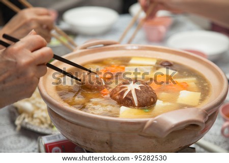 Eating Japanese winter hot soup - nabe