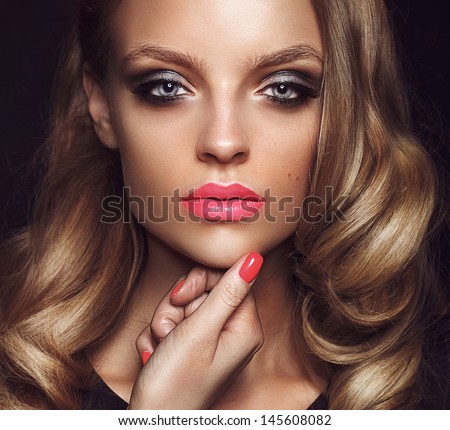 Beautiful young model with bright makeup and sunburn skin Evening make up, night, sunburn skin