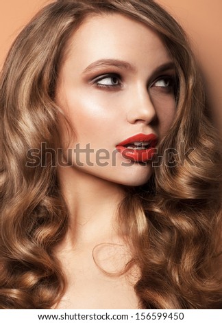 beautiful woman with red lips studio shot Color background, curly hair