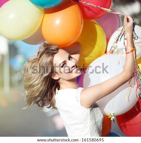 Young model woman smile with balloons Young model woman smile with balloons