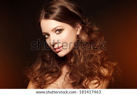 beautiful model with bright lips. evening make up Fashion red light, black background