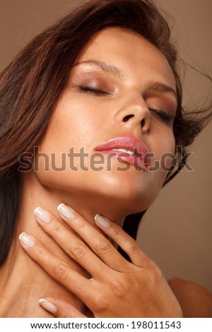 Beauty Woman with Perfect Makeup. Pink Lips and Nails. Beautiful Professional Holiday Makeup.