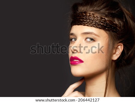 Beautiful face of a glamour woman with pink lips. studio shot and shine hair
