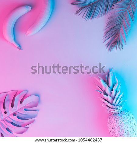 Tropical fruits and palm leaves in vibrant bold gradient holographic neon  colors. Concept art. Minimal surrealism background.