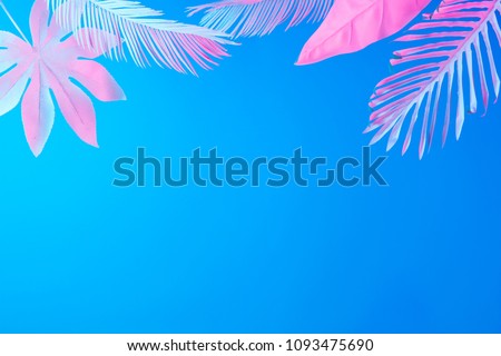 Tropical and palm leaves in vibrant bold gradient holographic neon  colors. Concept art. Minimal surrealism summer background.