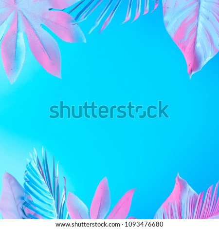 Tropical and palm leaves in vibrant bold gradient holographic neon  colors. Concept art. Minimal surrealism summer background.
