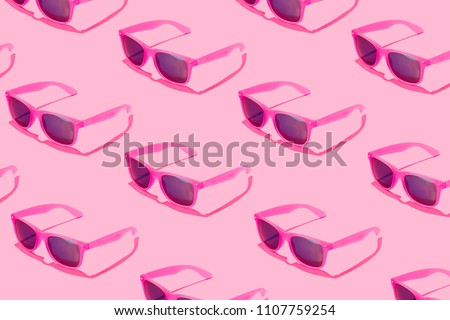 Pink sunglasses pattern on pastel background. Minimal summer concept. Isometric print.