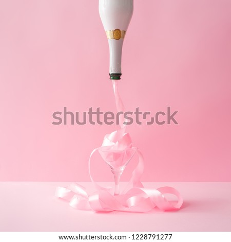Champagne bottle with pink party ribbon. Minimal Celebration concept.