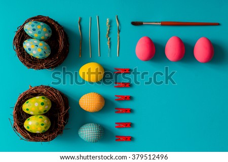 Flat lay of Easter eggs on blue background