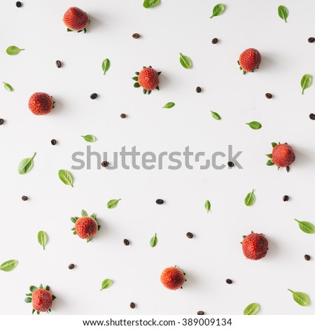 Colourful bright pattern made of strawberries, coffee beans and leaves.