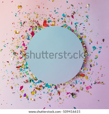 Colorful celebration background with party confetti on pink background. Flat lay.