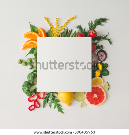 Creative layout made of various fruits and vegetables with white paper card. Flat lay. Food concept.