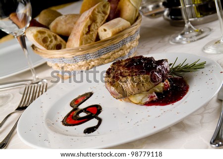 Beef steak on white plate, with violin key decoration./Musical Steak