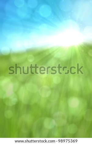 Spring or summer abstract nature background with glitter, bokeh and sun