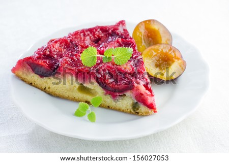 Slice of homemade plum cake on plate