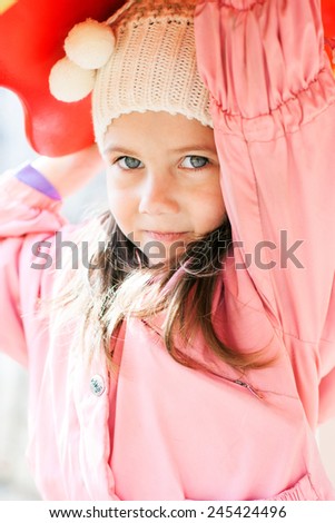 outdoor portrait of a little cute girl in the spring