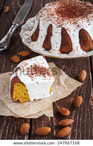 carrot cake with vanilla cream and almonds