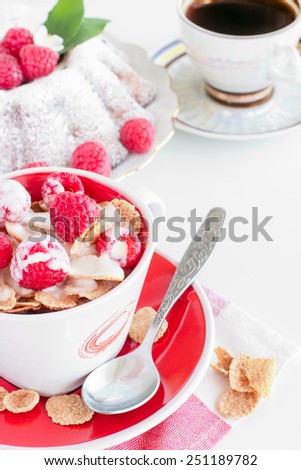 breakfast: cereal with berries homemade cake and a cup of coffee