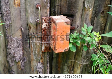 Rural fence made out of old rotten boards