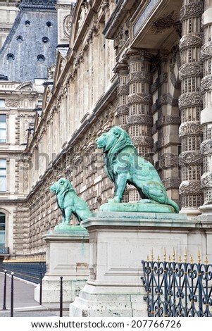 FRANCE, PARIS - April 29.2014: Sculptures of lions near a famous art gallery Louvre