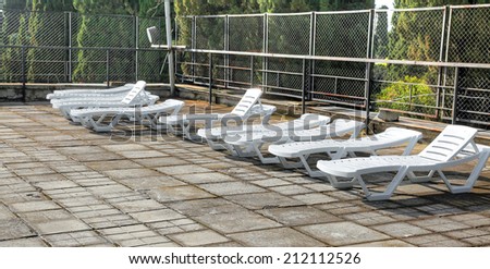 Empty deck-chairs on an open terrace in a resort hotel in Crimea