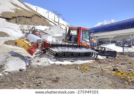 DOMBAY, RUSSIA - May 03.2015: Snowcat. Special transport vehicle on caterpillar to motion, used for preparation of skiing slopes and ski routes