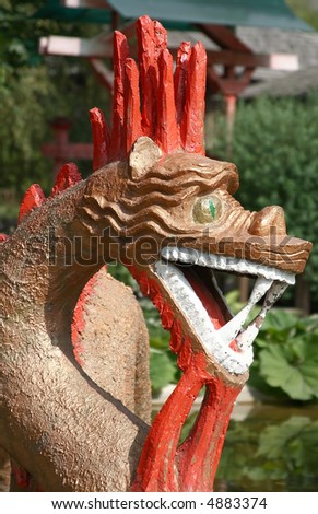 Sculpture of mythological animal, the head of dragon by the closeup