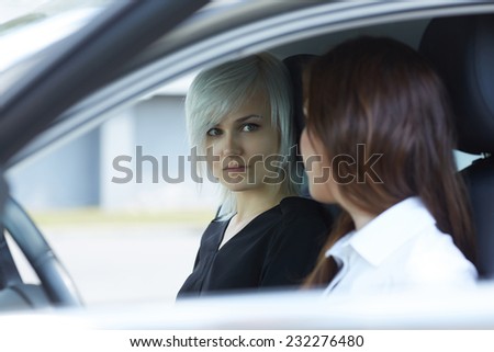 two women talking in the car