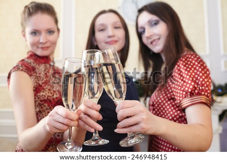 beautiful girls at a  party with glasses of champagne