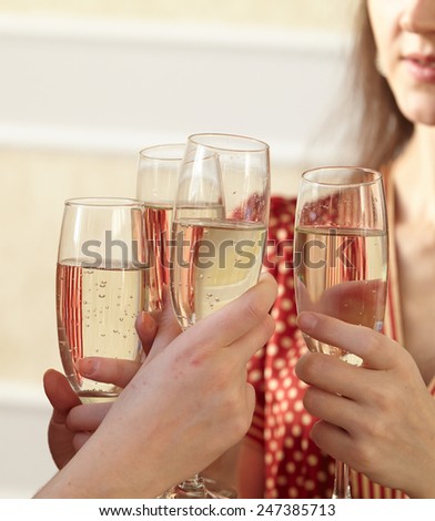 beautiful girls at a Christmas party with glasses of champagne