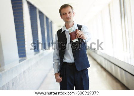 man holding a purse with money