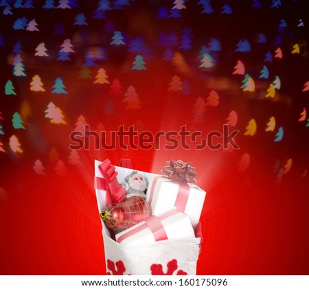 Christmas bag with presents and red tree pattern background