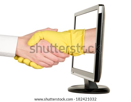 Industry worker with glove shakes hands with businessman on lcd monitor