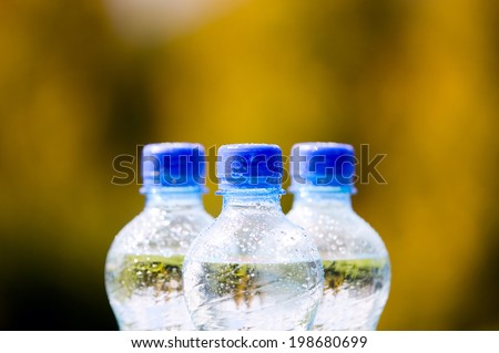 Mineral water bottles with blue plastic cork